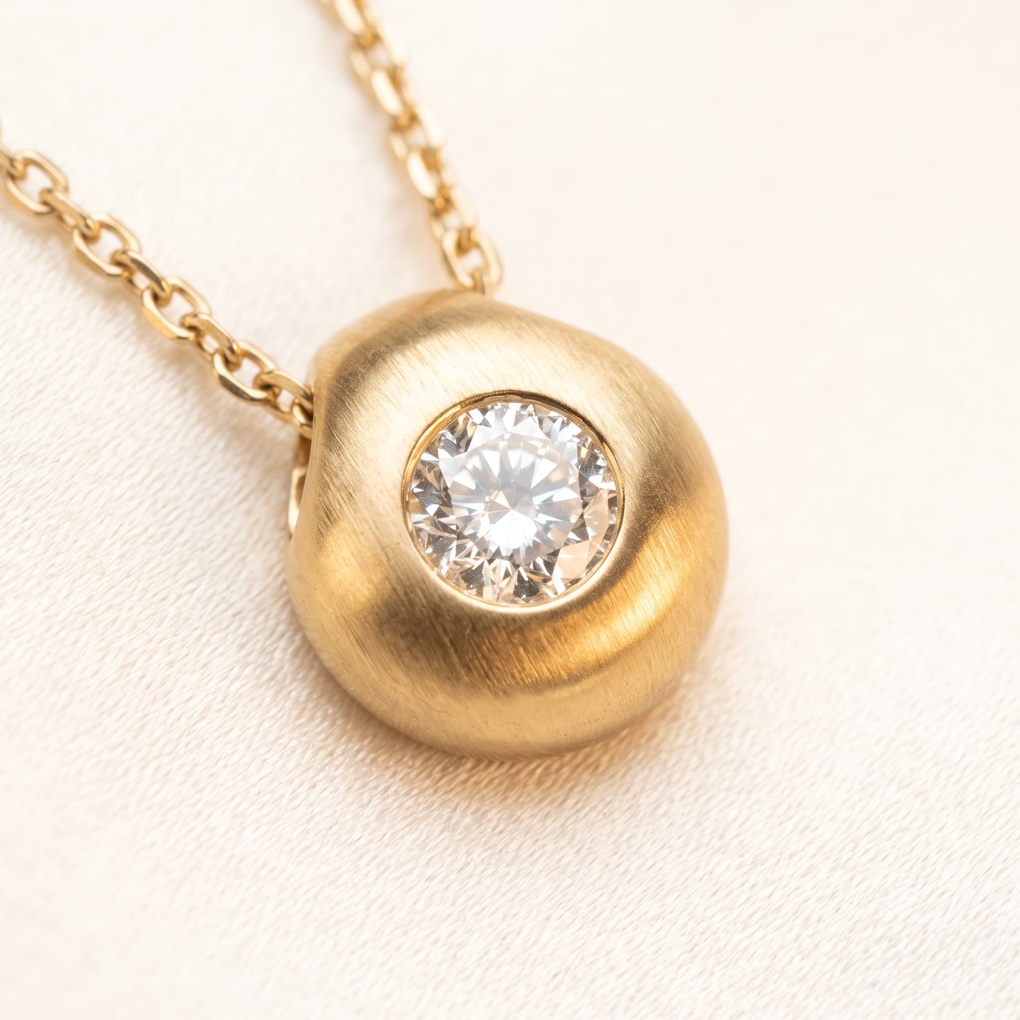 Macro of gold necklace detail